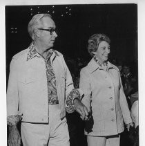 Here, Mayor and Mrs. Marriott strolling and holding hands