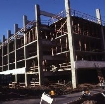 Site of the Downtown Plaza Parking Garage, Lot "G" near Macy's Department Store, 4th, 5th K and L Streets under construction. This view is looking east from the Fratt Building in Old Sacramento