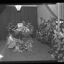 Casket with floral arrangements