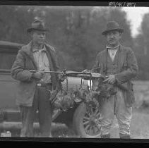 Men with dead quail