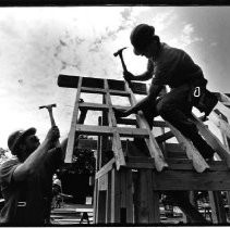 Peter Angella, left, and John Montgomery work on the rafters of a children's play house their Golden Sierra High School team was building in the design-and-build contest