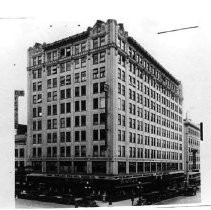 External view of the Forum building, with the Owl Drug Co. on ground floor