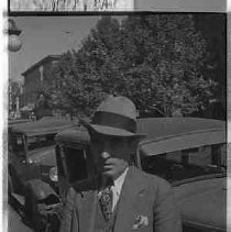 Man standing next to a car