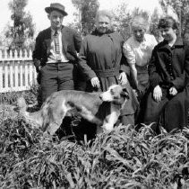 Unknown family in front of home