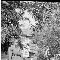 Unknown family on porch of home