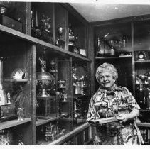 Leone (Mrs. F.B.) Hart, with trophies from her days as one of the country's top women polo players