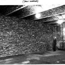 Project architect, John Worsley examines a restored brick wall in the California State Capitol building