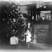 Two children at Christmas tree