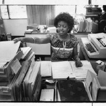 Salane Johnson, a clerk-typist, is a graduate of a job training program run by Creative Careers. The photo was taken at her job at the Insurance Company of North America