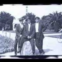 Three young men posed in Capitol Park