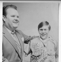 Duane Lowe congratulates Greg Troy of Sacramento, winner of a public speaking contest for Boy Scouts and Explorers