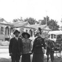 Three people in neighborhood setting