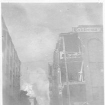 Untitled, San Francisco, post earthquake/fire. Partially collapsed building with other fires visible in background