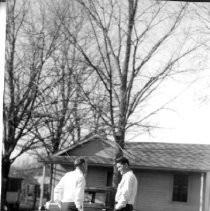 Two men standing in a street