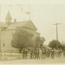 Class of School Students walking in front of their School