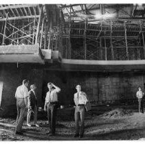 Sam Burns guiding members of the Sacramento Convention and Visitors Bureau through the theater of the Sacramento Community Center, under construction