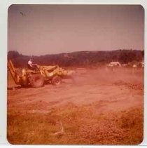 Photographs of Bolinas Bay. Tractor with backhoe helping with dig