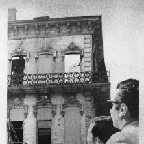 View of the fire damaged Fratt Building at 2nd and K Streets. Pointing at the damage is Wesley Witt, associate planner and on the right, Edwin Astone, supervisor for the Sacramento Redevelopment agency as they discuss how to proceed