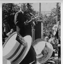 Presidential candidate Eugene McCarthy speaks to supporters wearing McCarthy hats