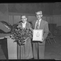 A couple receiving an award