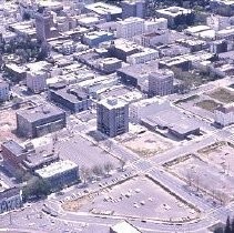 Views of redevelopment sites showing the demolition of buildings and reconstruction in the district. These views date from 1959 to 1970. These views date from 1959 to 1970. This view shows the I-5 freeway under construction looking north