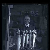 Man holding string of fish