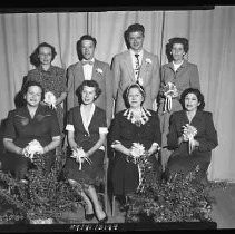 A group of women holding nosegays