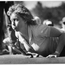 Caption reads: "Jane Seiber of Sweet Home, Oregon coaxes her entry, 'Weird Harrold' to a world's record leap in the Jumping Frog Jubilee."