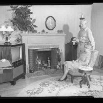 Couple seated in front of a fire