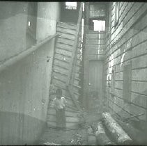 Views of redevelopment sites, renderings, and table models for the proposed Redevelopment District. Includes maps and site plans. This view is a street scene at 409-411 P Street