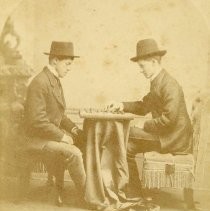 Boys playing checkers