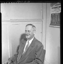 An unidentified man sitting