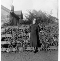 Woman posing at fence