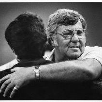 William Craib, President of California State Employee's Association, right hugs a state worker after an override vote call in 1979