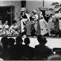 Unidentified group of dancers and musicians clad in traditional Japanese attire perform