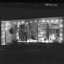 Front windows of a house decorated for Christmas