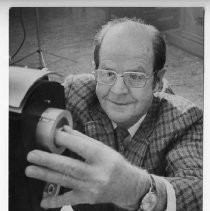 Dale Hutchison, Chief of the State Air Resources Board's research section, with a machine that collects and samples air particles to monitor air quality