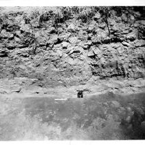 Drake's Bay. "Site of possible Drake's Fort archaeological excavation, Point Reyes, Drake's Bay, Marin County, California, August 18 , 1948. Green glass bottle end in layer of sand on top of clay strata."