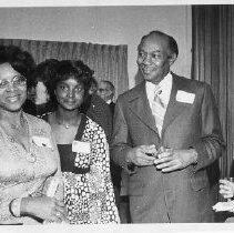 Herman Lawson, new City Council member, at a reception with his wife, daughter and friends