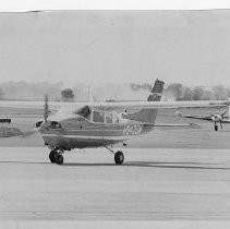 Dr. Alvin Marks, pilot and owner of Skymark Airlines. Here, his airplane, the Semper Fly III