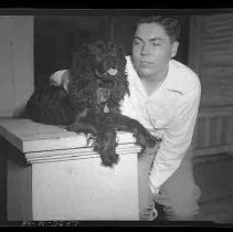 A boy and Cocker Spaniel dog