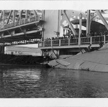 View of the Tower Bridge with debris from the 1950 flood blocking the flow of water in the Sacramento River