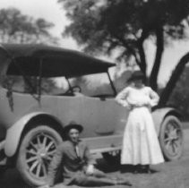Two people and an automobile