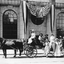 Capital National Bank building with ladies and horse with carriage