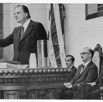 Billy Graham spoke to California lawmakers today in the Capitol. In the audience were, from left, legislative leaders Robert Moretti and James Mills and Gov. Ronald Reagan