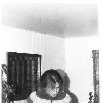 Unknown woman standing in a room