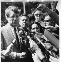 Senator Robert F. Kennedy (D-NY) campaigning for president in support of UFW, surrounded by reporters