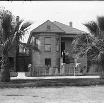 Couple on porch of home