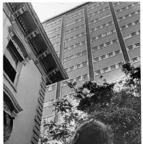 Corner of Stanford Home in foreground with State Water Resources Building in background