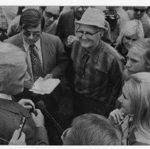 Senator Eugene McCarthy surrounded by supporters and newsmen after a speech